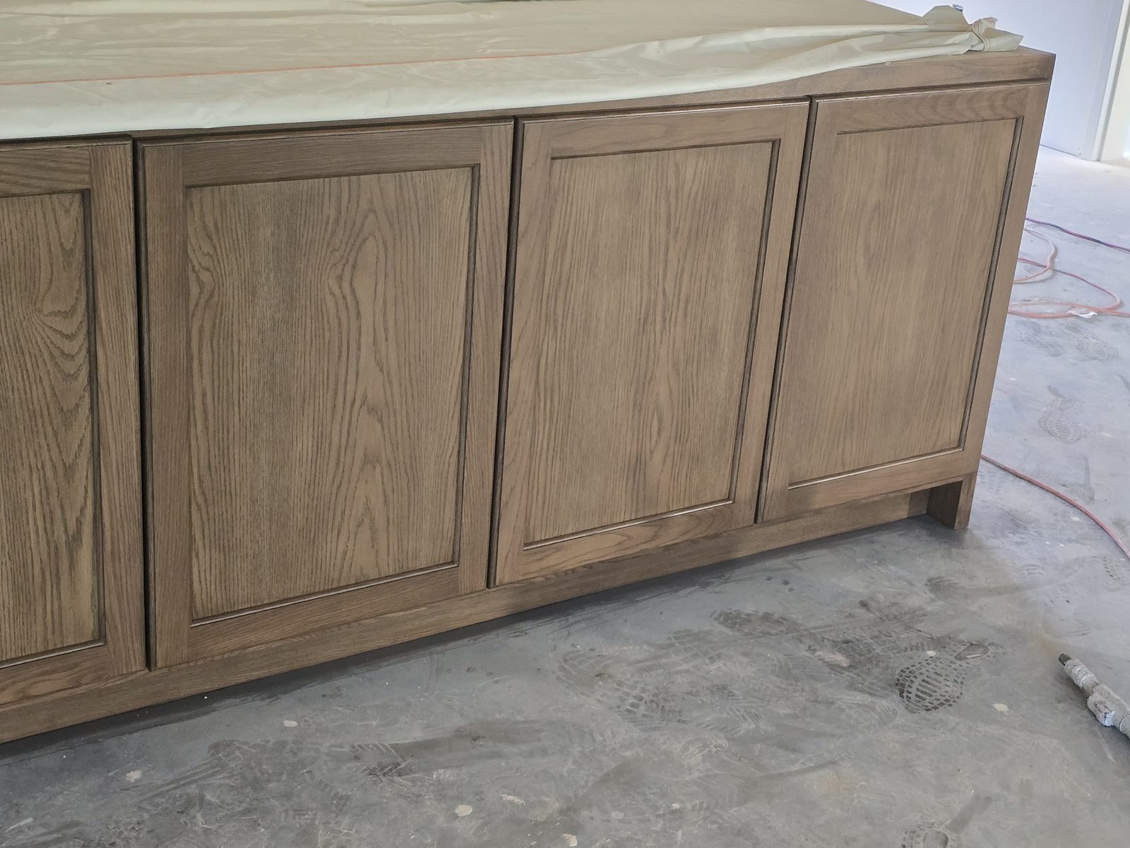 Custom stained wood finish by Off The Wall