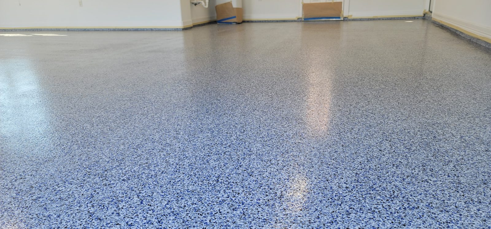 Completed epoxy garage floor by Off The Wall