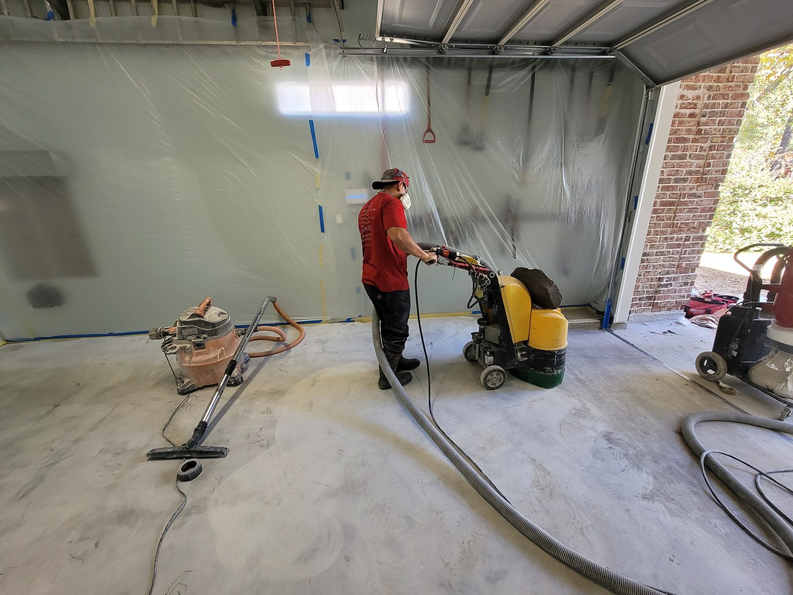 Garage floor being prepared for a durable coating