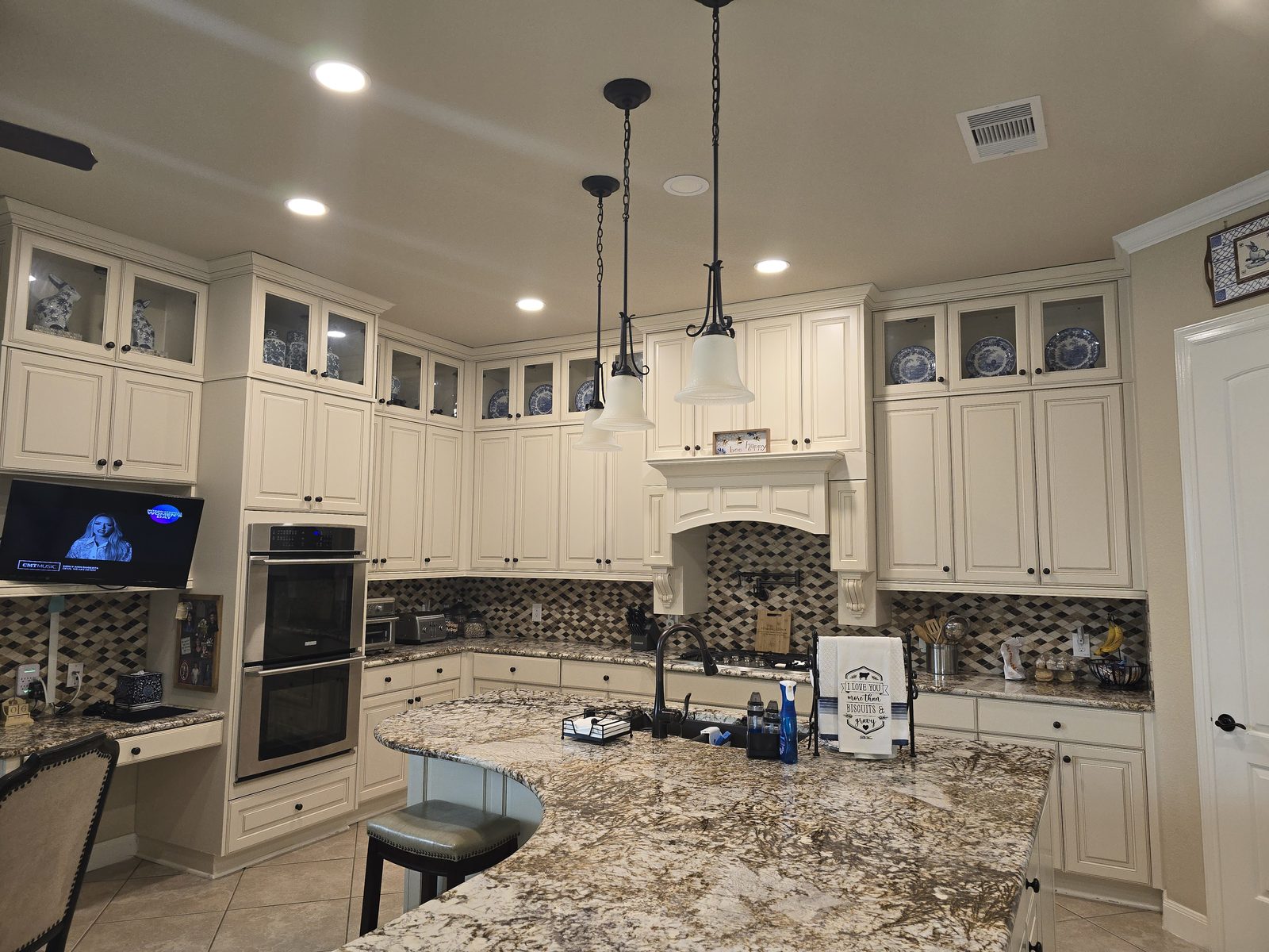 Completed painted kitchen cabinets by Off The Wall