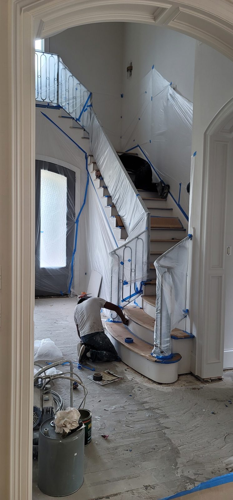 Off The Wall painter working inside a residential entry