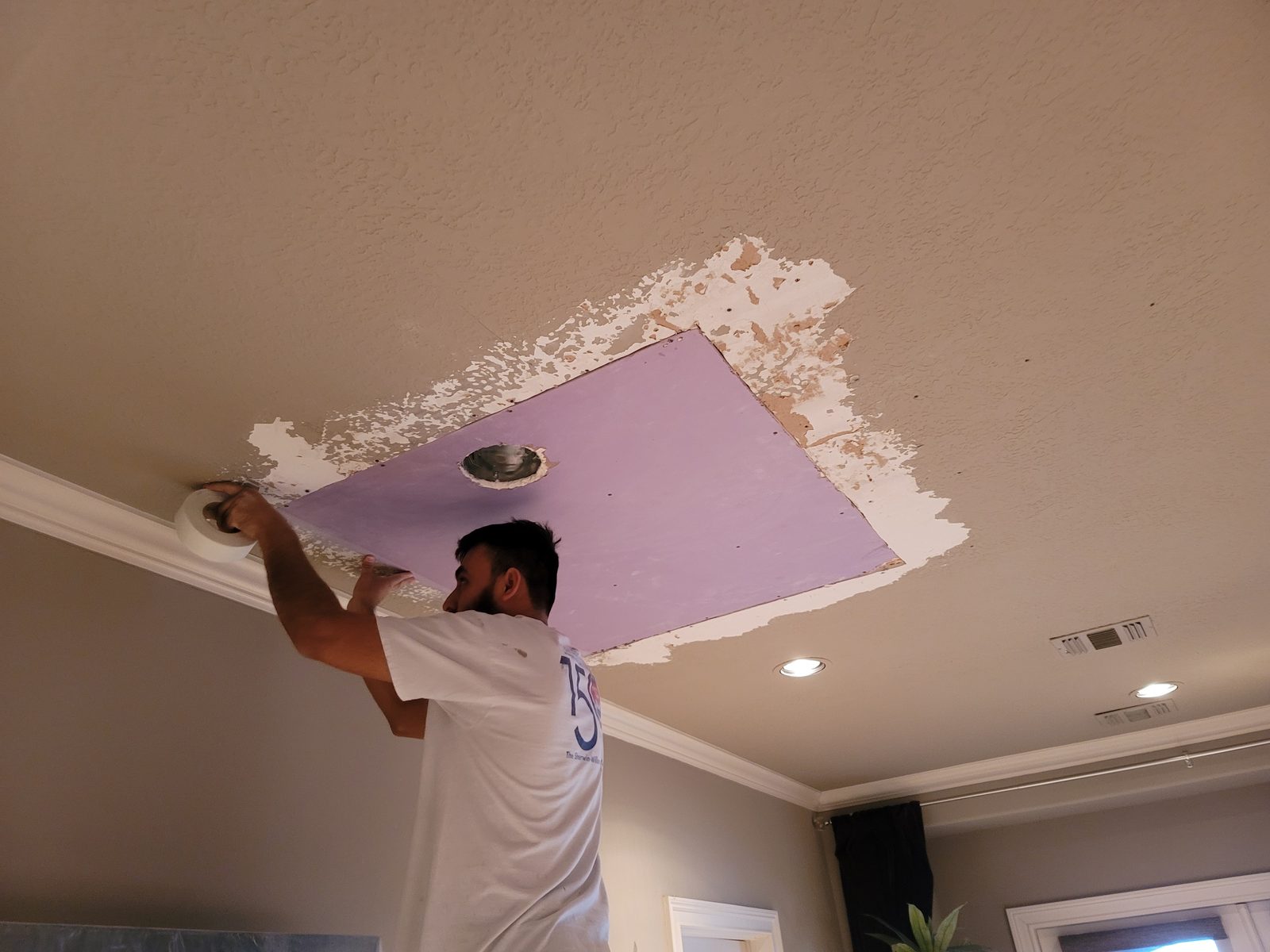 Ceiling patch repair being prepared for refinishing