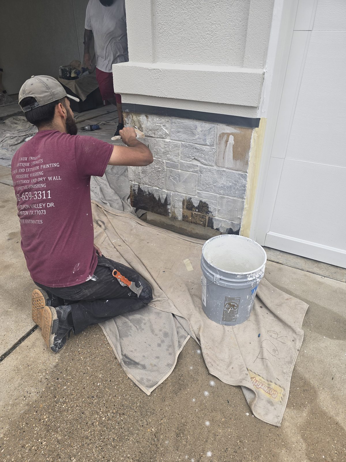 Off The Wall painter completing an exterior project