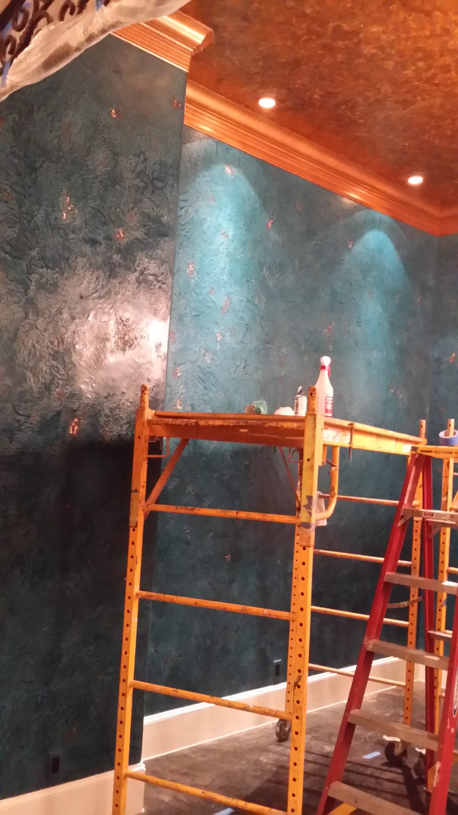 Decorative wall texture being applied by trowel