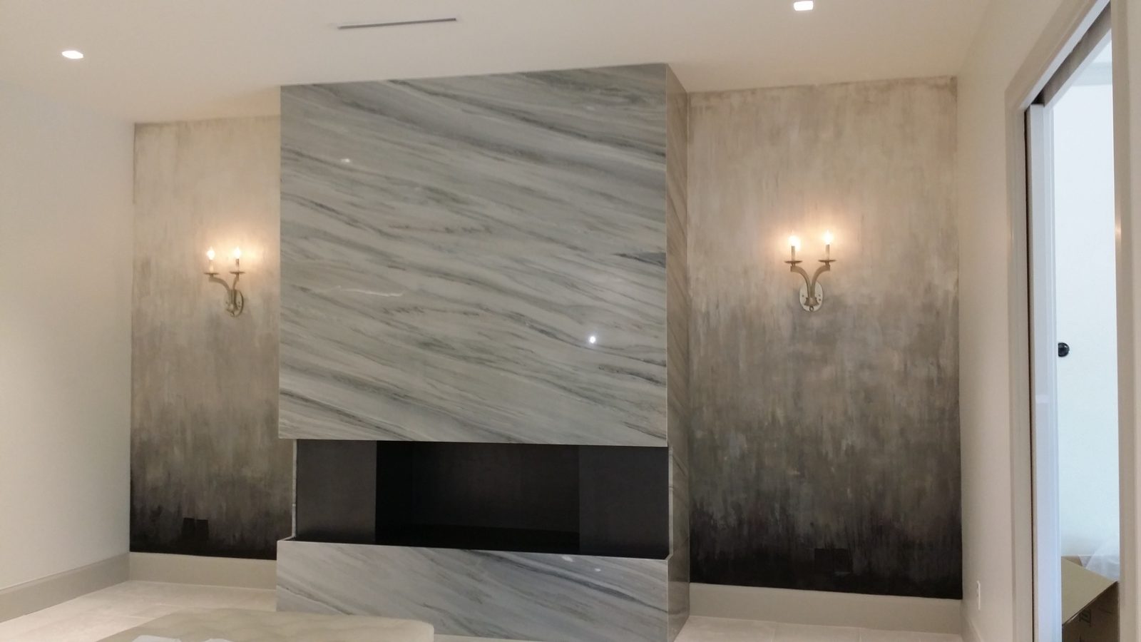 Polished Venetian plaster finish around a fireplace