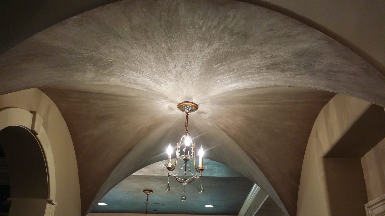 Decorative texture across a vaulted interior ceiling